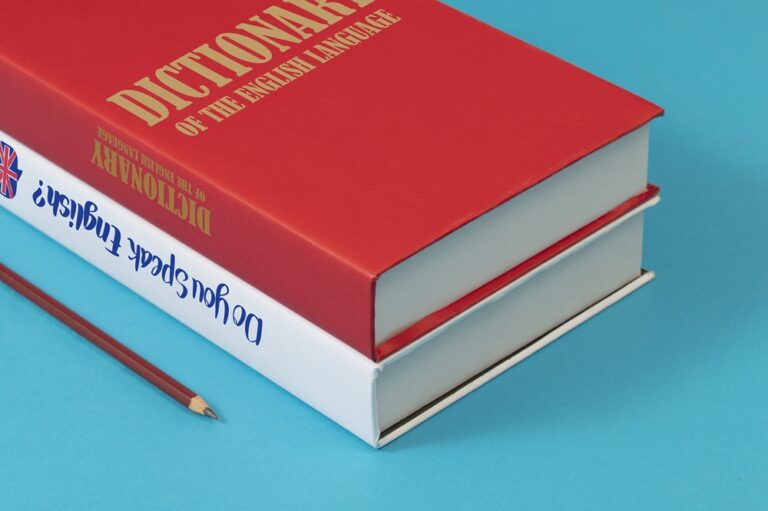 english-books-blue-background-high-angle